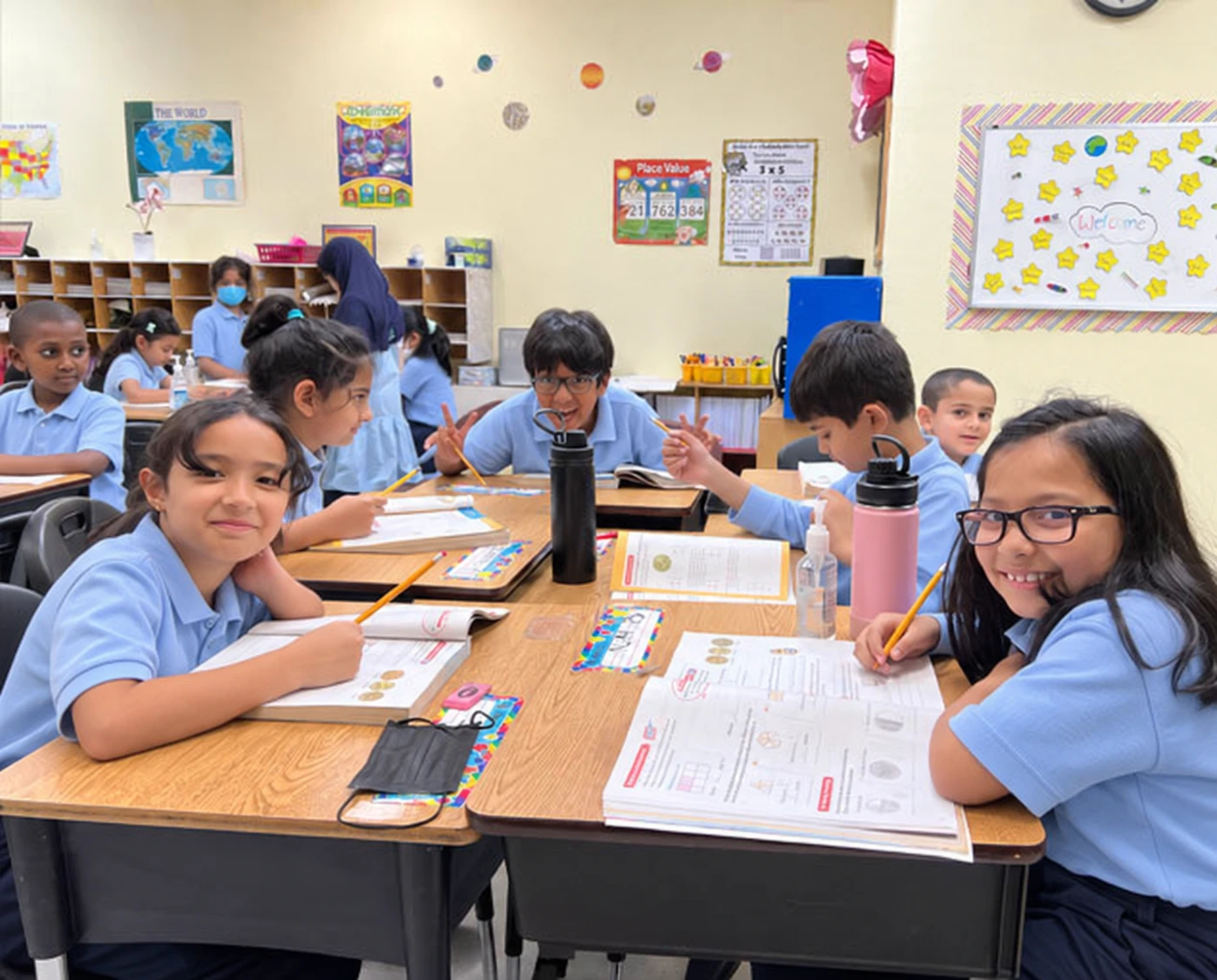 Elementary classroom; uniforms digitally edited
