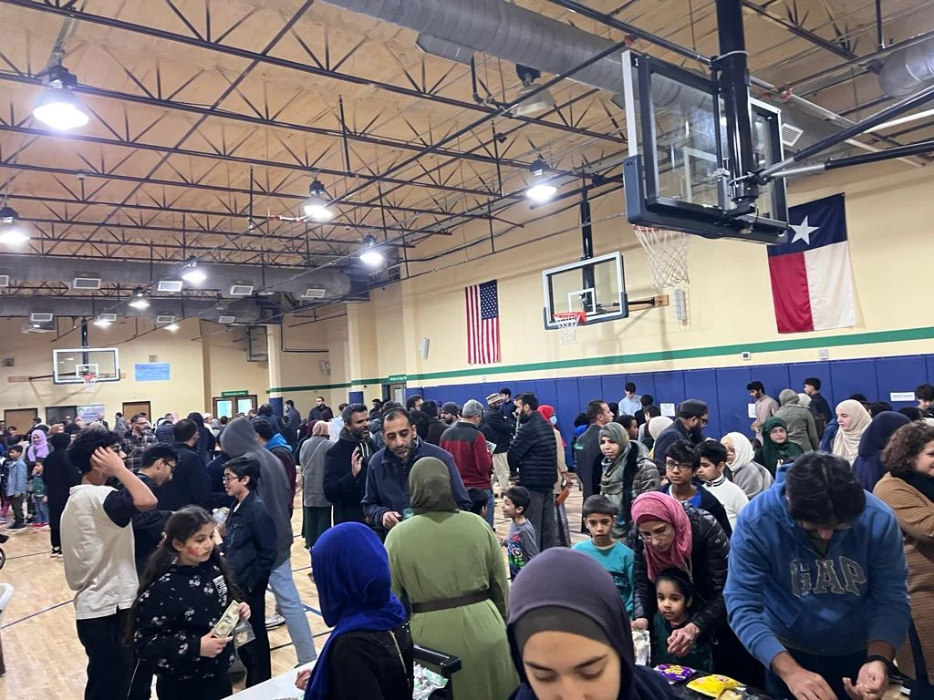 Families gathered in the school gymnasium