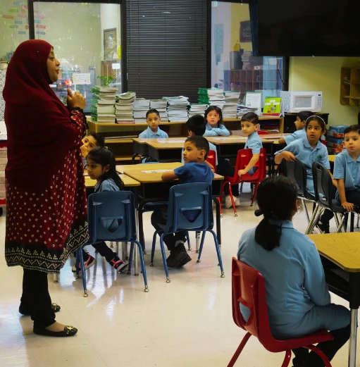 A teacher and students in a Good Tree classroom