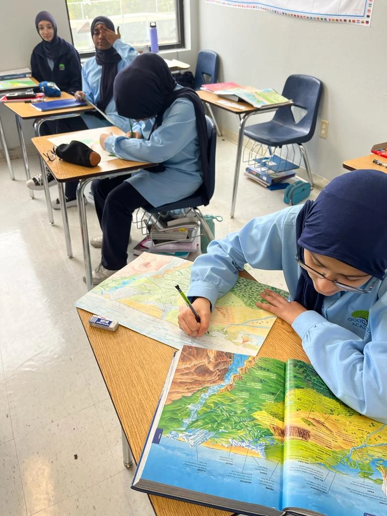 Students working with maps in class