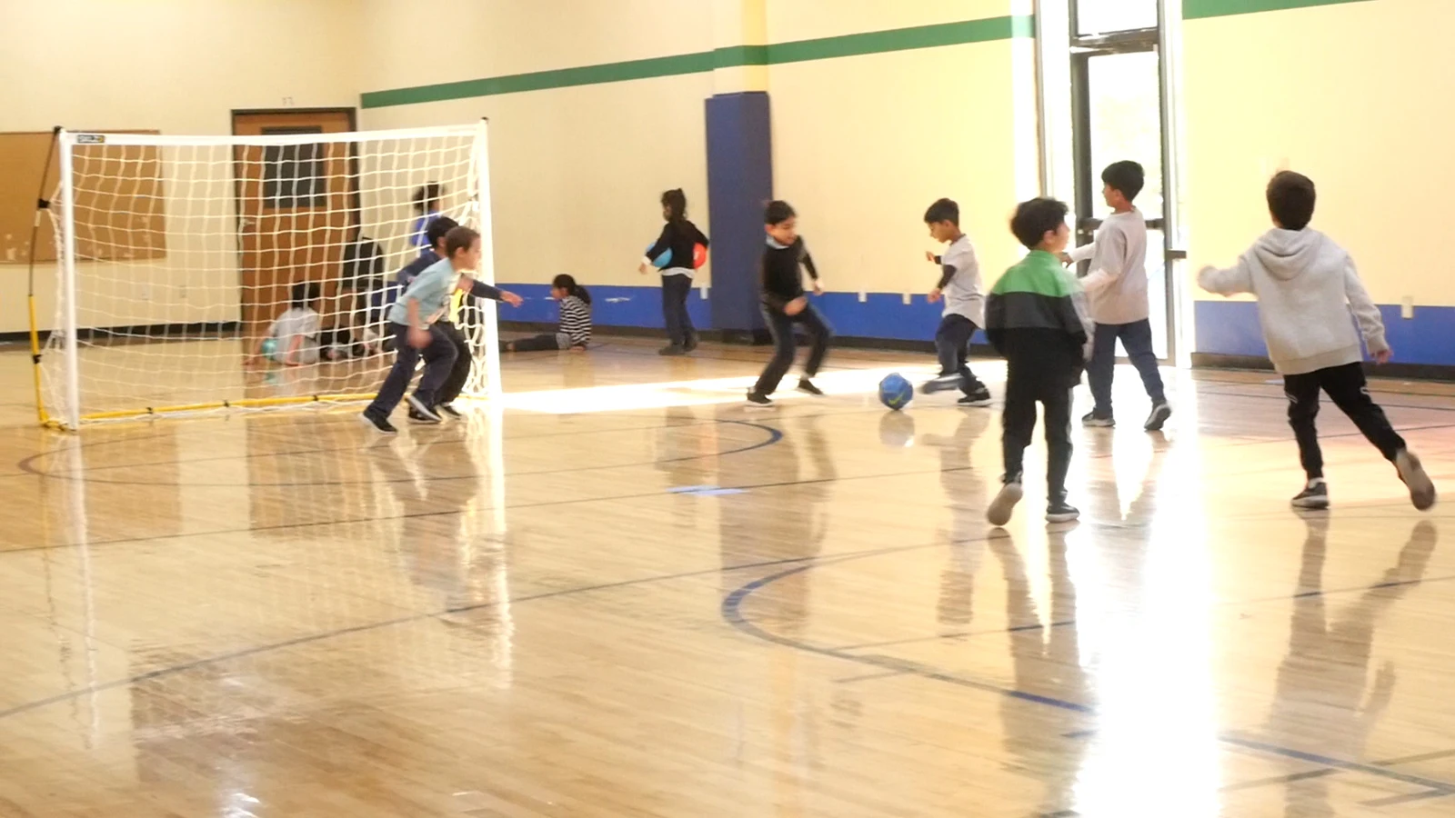 Students playing volleyball in the gym