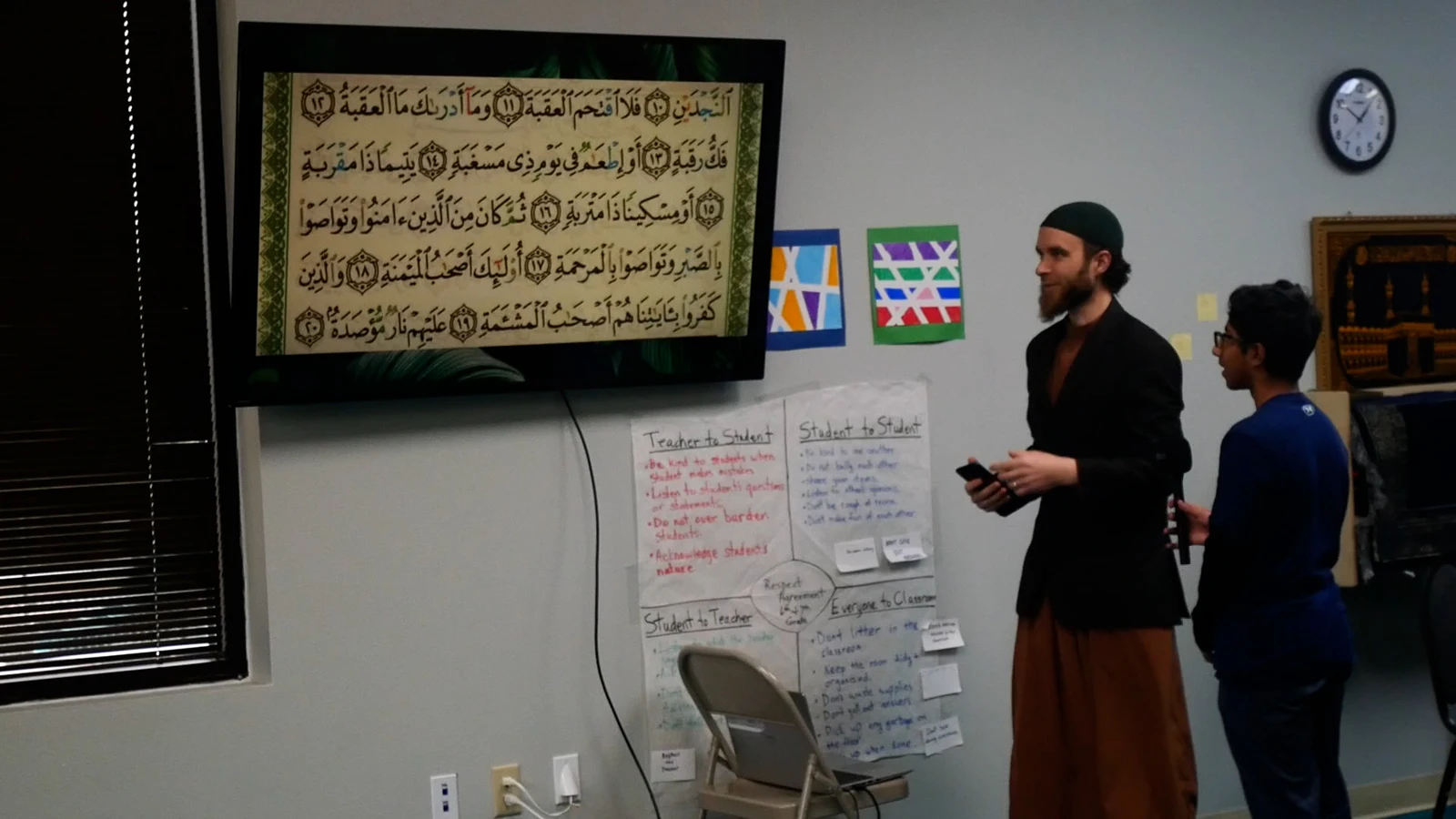 A teacher leading an Islamic studies lesson