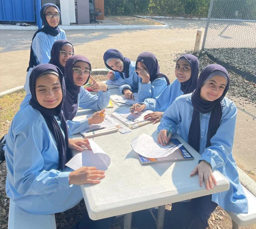 Good Tree students studying together at an outdoor table